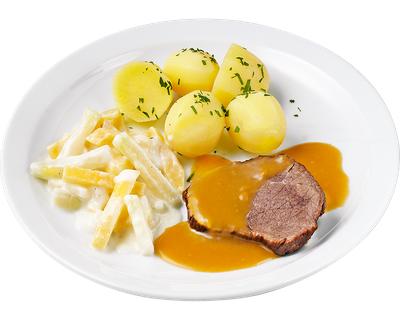 Schweinebraten mit Sauce und Salzkartoffeln